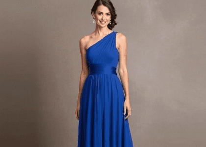 One shoulder blue bridesmaid dress with elegant detailing and flowing fabric, perfect for wedding celebrations.