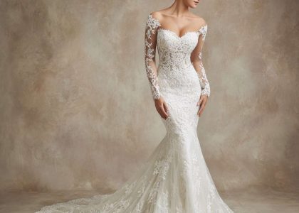 Stunning bride in a mermaid lace wedding dress with Chantilly lace overlay, sweetheart neckline, long illusion lace sleeves, dramatic flare at the knee, and sweeping chapel train, perfect for a luxurious ballroom setting.